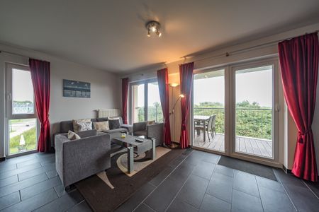 NordseeResort Friesland NordseeResort Friesland 51-2-N Schillig - Wohn-Essbereich mit Couch