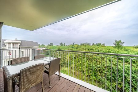 NordseeResort Friesland NordseeResort Friesland 51-2-N Schillig - Überdachter Balkon mit Sitzgelegenheit