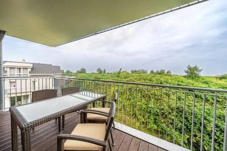 NordseeResort Friesland NordseeResort Friesland 51-2-N Schillig - Überdachter Balkon mit Sitzgelegenheit