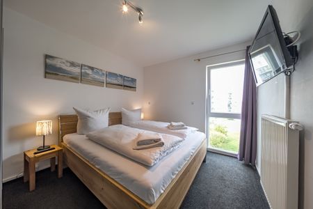 NordseeResort Friesland NordseeResort Friesland 51-2-N Schillig - Schlafzimmer mit Doppelbett