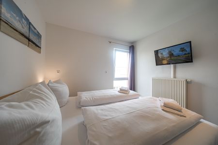 NordseeResort Friesland NordseeResort Friesland 51-2-N Schillig - Schlafzimmer mit Doppelbett