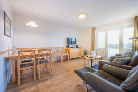 Hus Inselkieker Hus Inselkieker 107 Schillig - Wohn-Essbereich mit  Couch und Esstisch
