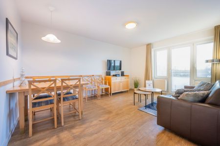 Hus Inselkieker Hus Inselkieker 107 Schillig - Wohn-Essbereich mit Couch und Esstisch