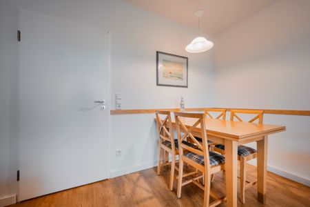 Hus Inselkieker Hus Inselkieker 107 Schillig - Wohn-Essbereich mit Esstisch und Sitzgelegenheit