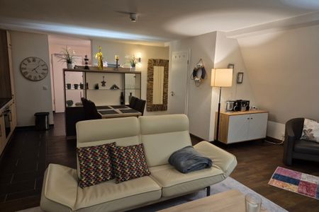 Resort Deichgraf Resort Deichgraf 31-21 Wremen - Wohn-Essbereich mit Couch