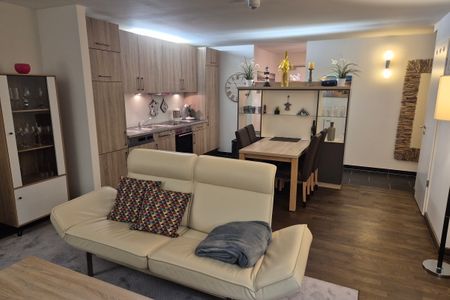 Resort Deichgraf Resort Deichgraf 31-21 Wremen - Wohn-Essbereich mit Couch