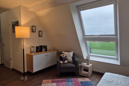 Resort Deichgraf Resort Deichgraf 31-21 Wremen - Wohn-Essbereich mit Couch
