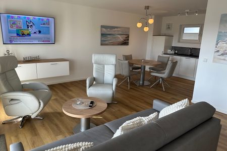 NordseeResort Friesland Nordseeresort Friesland 50-3-m Schillig - Wohn-Essbereich mit Flatscreen-TV