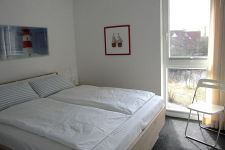 NordseeResort Friesland NordseeResort Friesland 51-2-S Schillig - Schlafzimmer mit Doppelbett