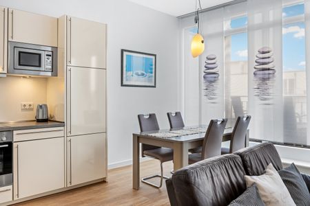 DünenResort Binz DünenResort Binz 435 Rügen - Wohn-Essbereich mit Esstisch und Sitzgelegenheit