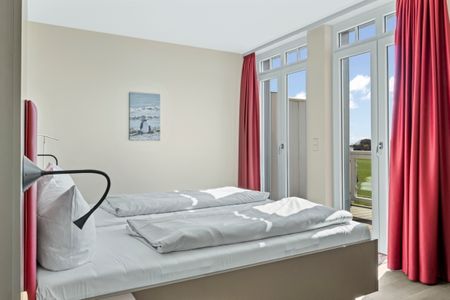 Resort Deichgraf Resort Deichgraf 27-19 Wremen - Schlafzimmer mit Doppelbett