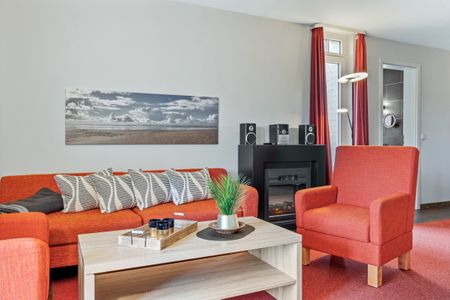 Resort Deichgraf Resort Deichgraf 31-02 Wremen - Wohnzimmer mit Kamin