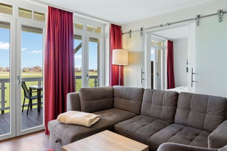 Resort Deichgraf Resort Deichgraf 31-08 Wremen - Wohnbereich mit Couch