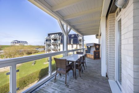 Resort Deichgraf Resort Deichgraf 31-11 Wremen - Überdachter Balkon mit Sitzgelegenheit