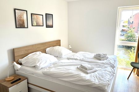 NordseeResort Friesland Ferienhäuser Nordseeresort Friesland 50-1-s Schillig - Schlafzimmer mit Doppelbett