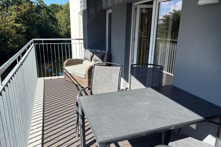 NordseeResort Friesland Ferienhäuser Nordseeresort Friesland 50-1-s Schillig - Balkon mit Gartenmöbeln