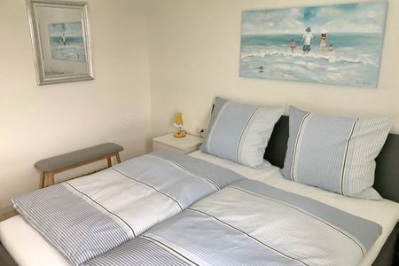 NordseeResort Friesland Ferienhäuser NordseeResort Friesland 48-6-n Schillig - Schlafzimmer mit Doppelbett