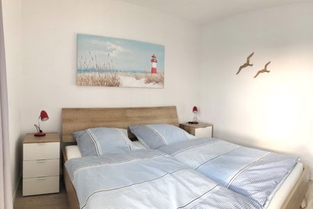 NordseeResort Friesland Ferienhäuser NordseeResort Friesland 48-6-n Schillig - Schlafzimmer mit Doppelbett