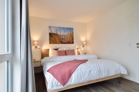 NordseeResort Friesland Ferienhäuser Nordseeresort Friesland 05 Schillig - Schlafzimmer mit Doppelbett