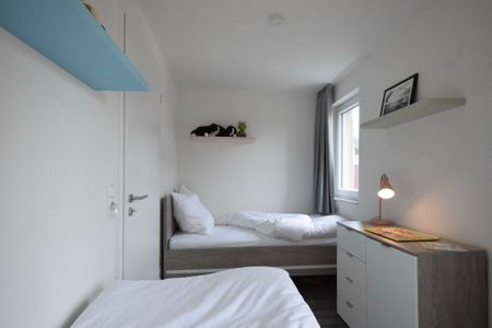 NordseeResort Friesland Ferienhäuser Nordseeresort Friesland 05 Schillig - Schlafzimmer mit zwei Einzelbetten
