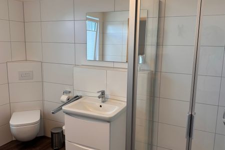 NordseeResort Friesland Ferienhäuser Nordseeresort Friesland 05 Schillig - Badezimmer mit Dusche