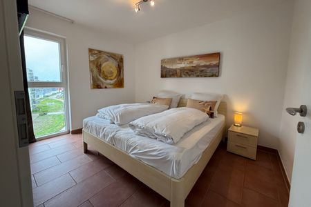 NordseeResort Friesland NordseeResort Friesland 51-4-N Schillig - Schlafzimmer mit Doppelbett