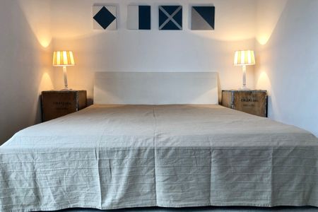 NordseeResort Friesland Ferienhäuser NordseeResort Friesland 1 Schillig - Schlafzimmer mit Doppelbett