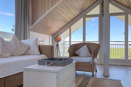 NordseeResort Friesland Ferienhäuser NordseeResort Friesland 1 Schillig - Wohnbereich mit Couch