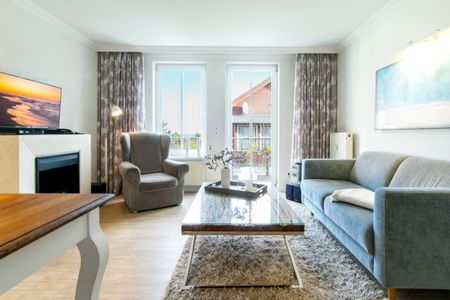 Seehof Seehof 224 Usedom - Wohn-Essbereich mit Couch und Flatscreen-TV