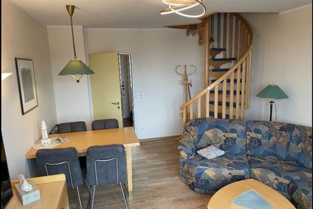 Hus Inselkieker Hus Inselkieker 217 Schillig - Wohn-Essbereich mit Couch und Esstisch