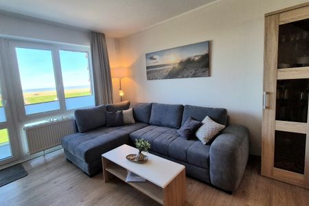 Hus Strandkieker Hus Strandkieker 03 Schillig - Wohn-Essbereich mit Couch