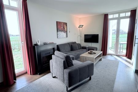 Resort Deichgraf Resort Deichgraf 31-04 Wremen - Wohn-Essbereich mit Couch