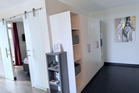 Resort Deichgraf Resort Deichgraf 31-04 Wremen - Wohn-Essbereich mit Zugang zum Schlafzimmer