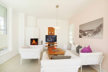 Ostseeland Ostseeland Kaitänsweg 17 Usedom - Wohnzimmer mit Kamim im Kapitänsweg 17 in Karlshagen auf Usedom