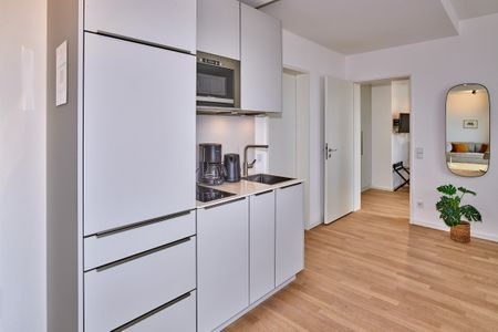 Lüttjeod Apartmentvilla Lüttjeod Apartmentvilla 18 Langeoog - Küchenzeile mit Mikrowelle im lalo18, Hauptstraße 9, Lüttjeod Apartmentvilla 18 auf Langeoog