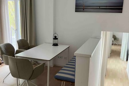 Lüttjeod Apartmentvilla Lüttjeod Apartmentvilla 09 Langeoog - Wohn-Essbereich mit Sitzgelegenheit im lalo09, Hauptstraße 9, Lüttjeod Apartmentvilla 09 auf Langeoog
