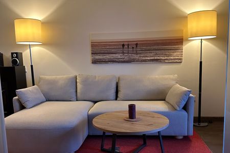 Resort Deichgraf Resort Deichgraf 27-13 Wremen - Wohn-Essbereich mit Couch