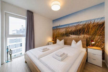 NordseeResort Friesland NordseeResort Friesland 48-6-n Schillig - Schlafzimmer mit Doppelbett im sinf48-6-N, Nordsee-Resort Friesland, Mellumweg 1 in Schillig