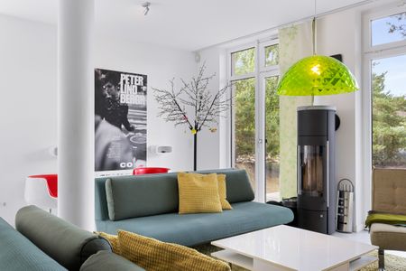 Ostseeland Ostseeland Lotsenstieg 15 Usedom - Wohn-Essbereich mit Kamin im usollo15, Lotsenstieg 15 in Karlshagen