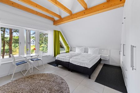 Ostseeland Ostseeland Lotsenstieg 15 Usedom - Großes Schlafzimmer mit Doppelbett im usollo15, Lotsenstieg 15 in Karlshagen