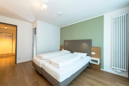 Apartmentvilla Anna See Apartmentvilla Anna See 1-03 Langeoog - Schlafzimmer mit Doppelbett und Kleiderschrank