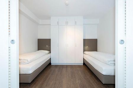 Apartmentvilla Anna See Apartmentvilla Anna See 1-13 Langeoog - Schlafzimmer mit Einzelbetten und Kleiderschrank