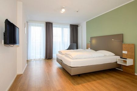 Apartmentvilla Anna See Apartmentvilla Anna See 1-14 Langeoog - Schlafzimmer mit Doppelbett und TV