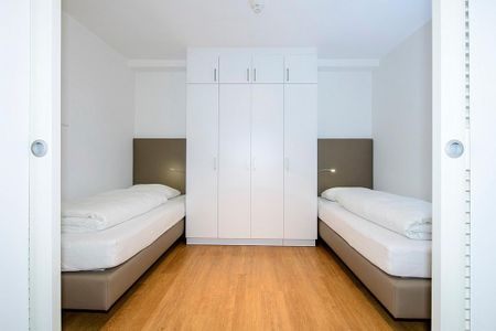 Apartmentvilla Anna See Apartmentvilla Anna See 1-14 Langeoog - Schlafzimmer mit Einzelbetten und Kleiderschrank