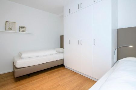 Apartmentvilla Anna See Apartmentvilla Anna See 1-14 Langeoog - Schlafzimmer mit Einzelbetten und Kleiderschrank