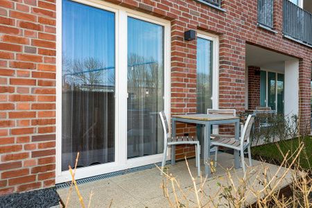 Apartmentvilla Anna See Apartmentvilla Anna See 1-16 Langeoog - Terrasse mit Tisch und Sitzgelegenheit