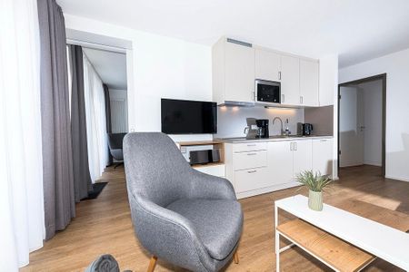 Apartmentvilla Anna See Apartmentvilla Anna See 1-17 Langeoog - Wohn-Essbereich mit Küchenzeile und  TV
