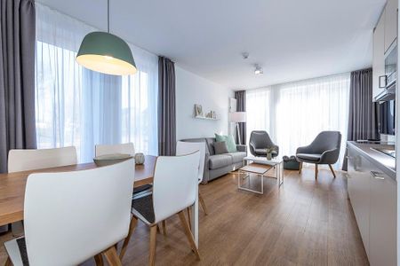 Apartmentvilla Anna See Apartmentvilla Anna See 1-17 Langeoog - Wohn-Essbereich mit Esstisch und Sitzgelegenheiten