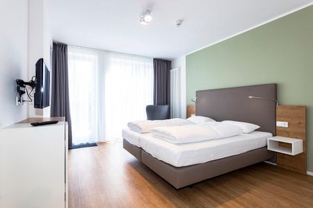 Apartmentvilla Anna See Apartmentvilla Anna See 1-17 Langeoog - Schlafzimmer mit Doppelbett und TV