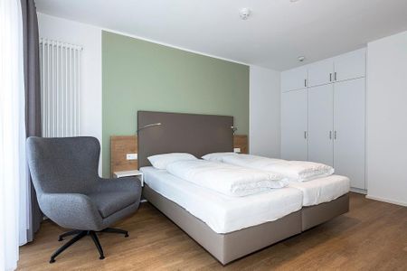Apartmentvilla Anna See Apartmentvilla Anna See 1-17 Langeoog - Schlafzimmer mit Doppelbett und Kleiderschrank